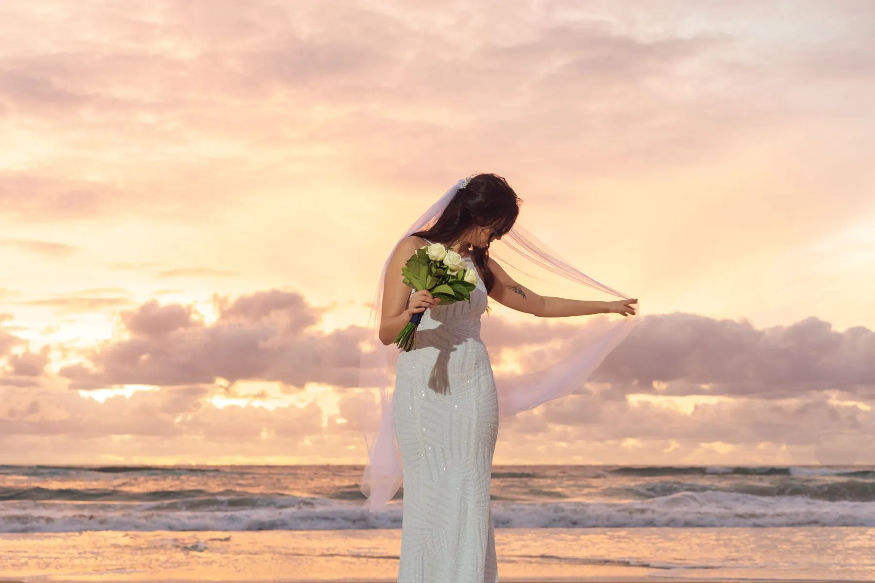 Bride at sunset, beach wedding