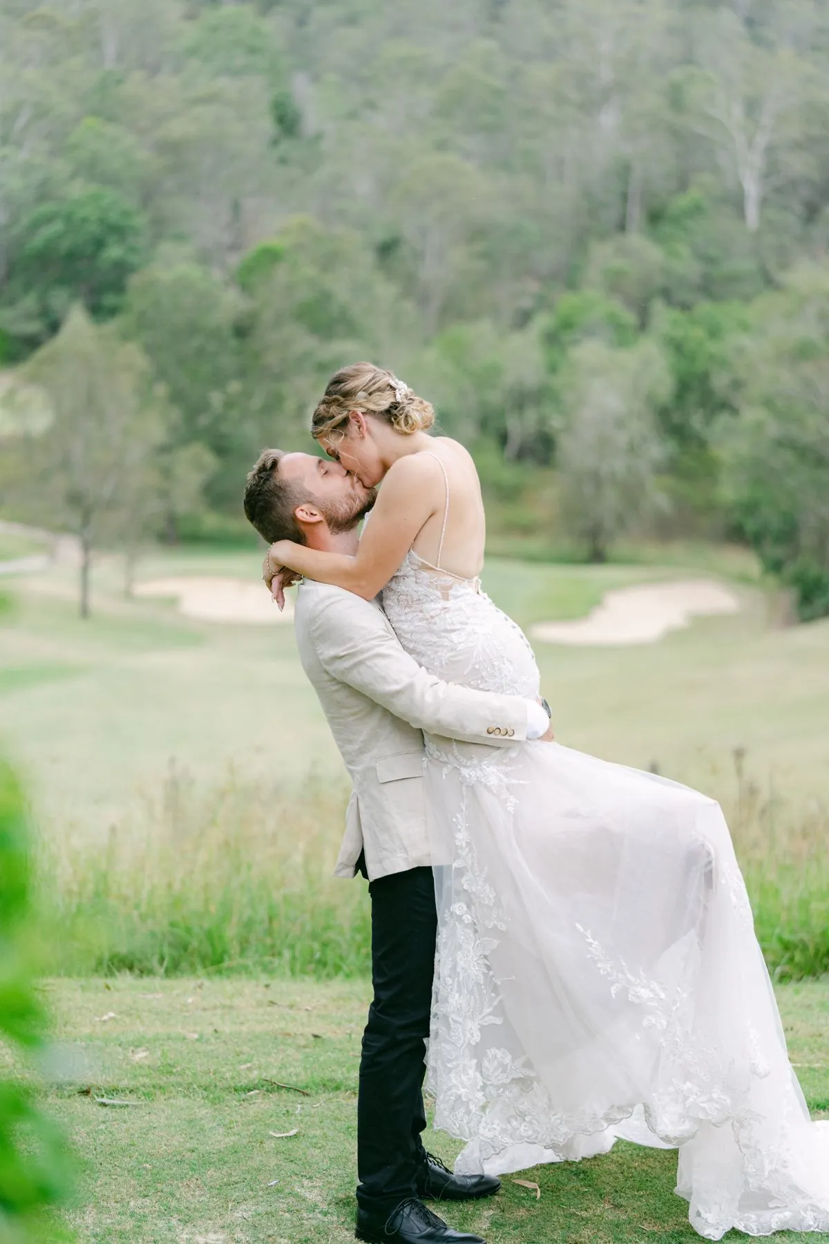 Wedding couple portrait on the green